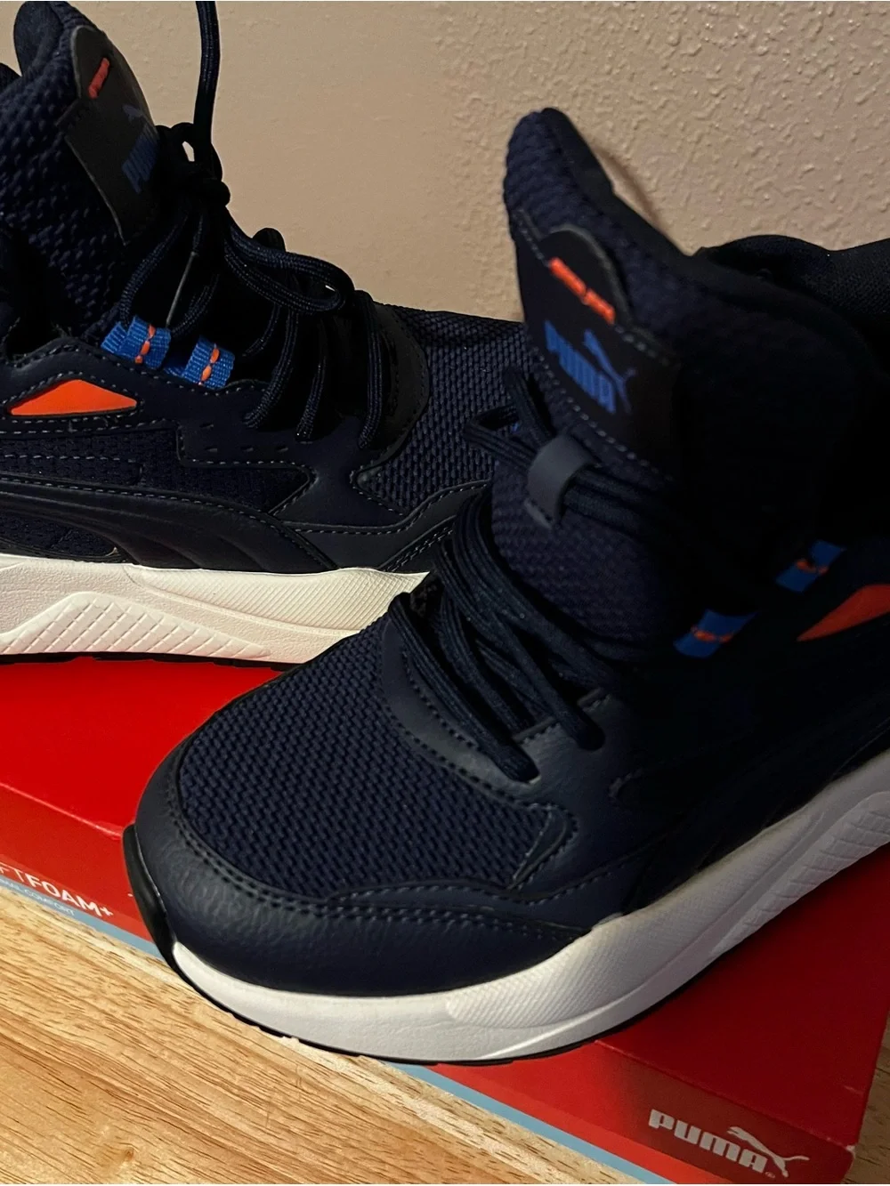 Puma Navy Blue High-Top Athletic Sneakers with Orange Accents